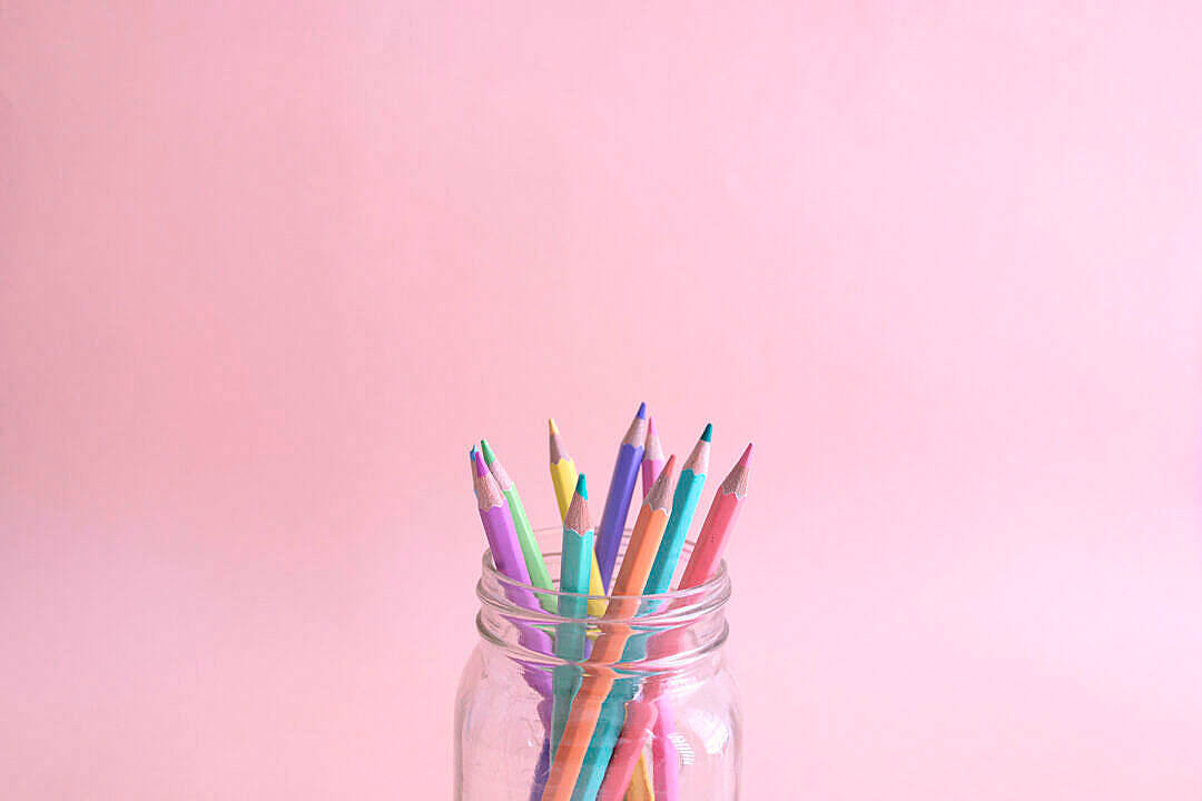 Color Pencils In Jar With Pastel Pink Color Background