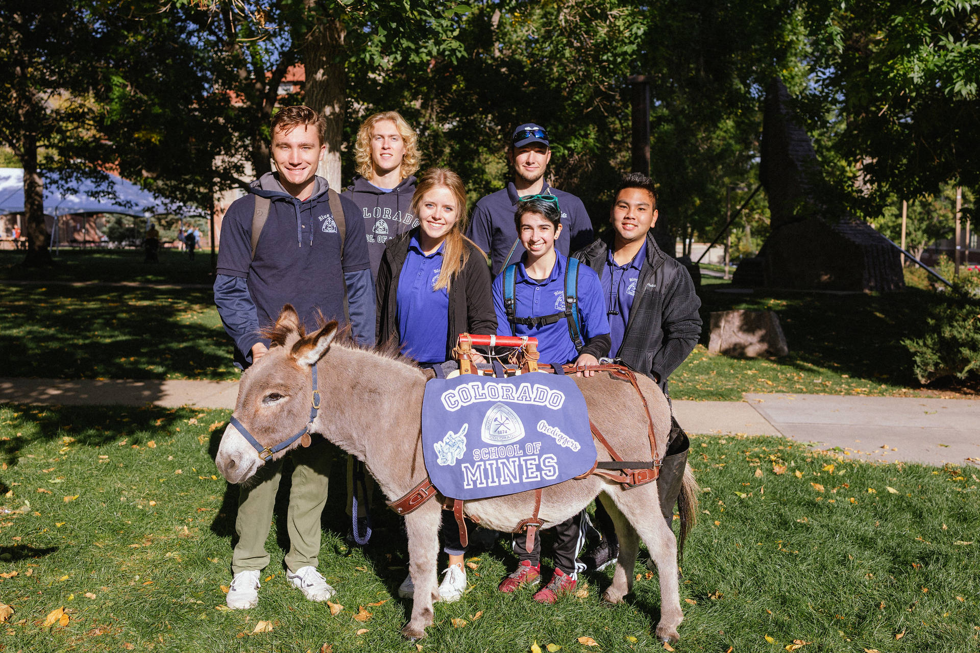 Colorado School Of Mines Students And Mascot Background