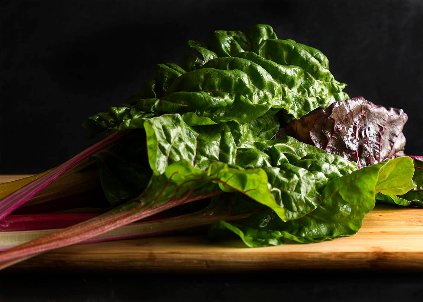 Colored Swiss Chard Vegetable On Wooden Board Background