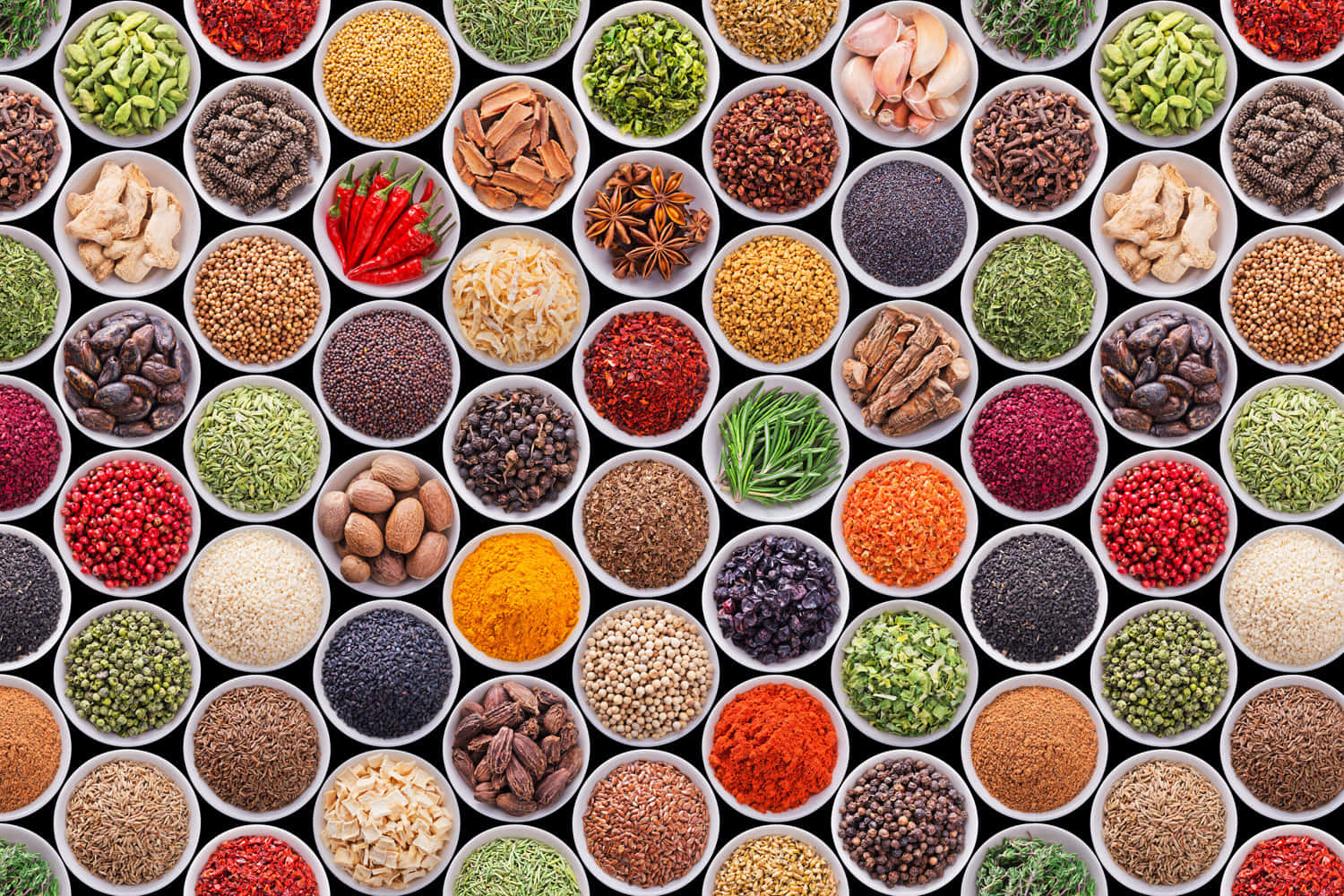 Colorful Assorted Spices On Circle Saucers Background