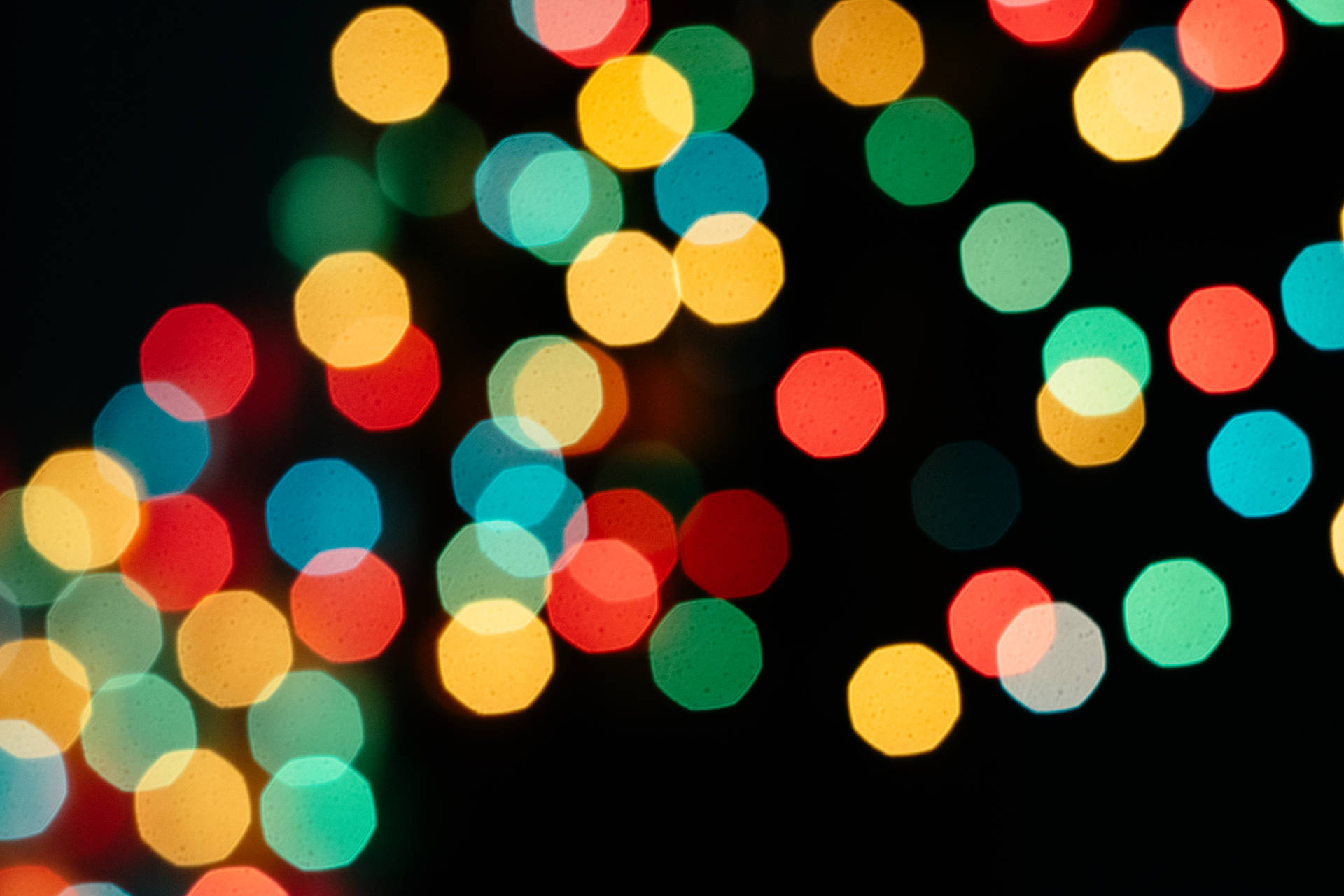 Colorful Bokeh Pattern On Black Background Background