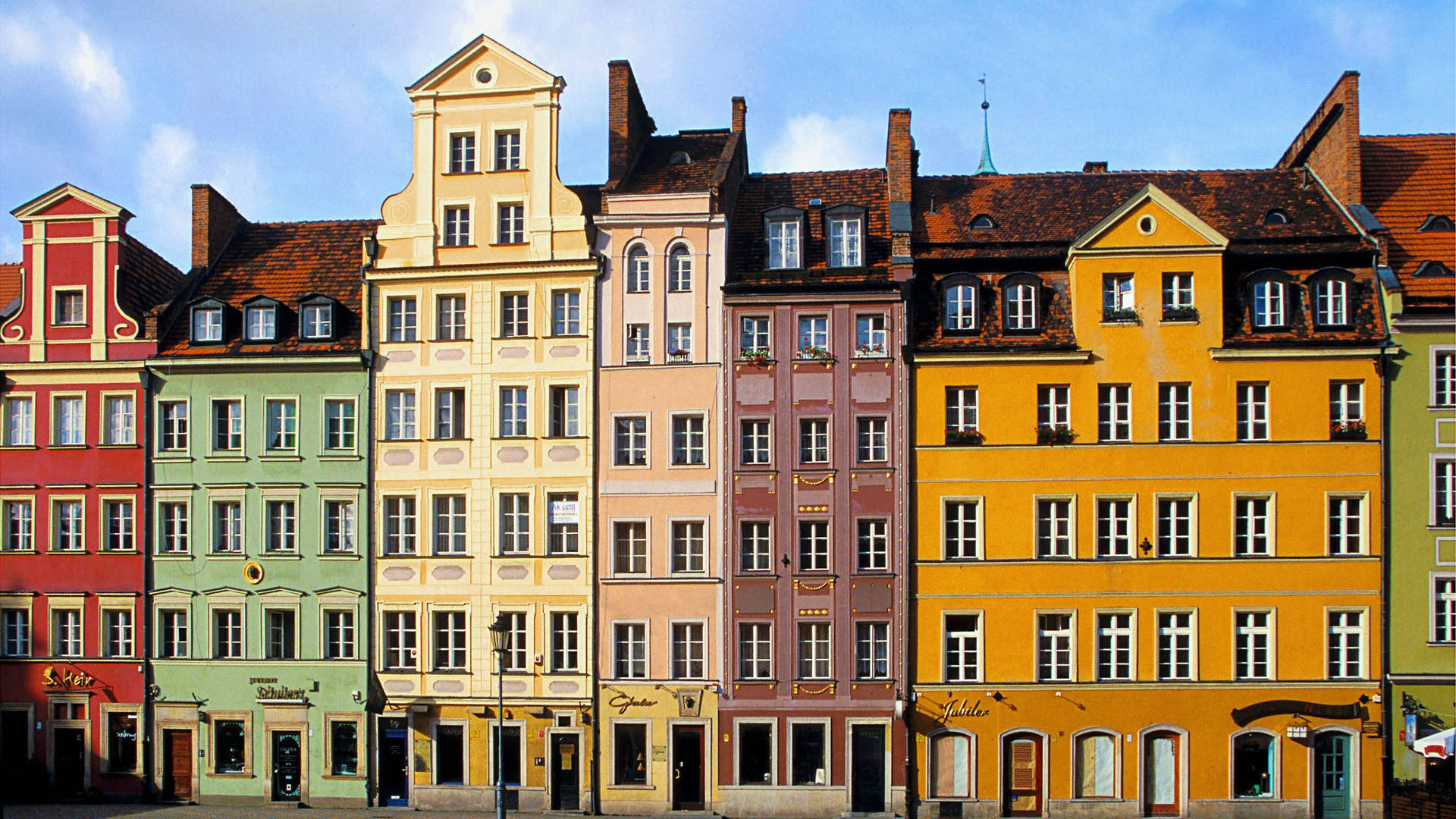 Colorful Buildings Around Market Square In Krakow Poland Background