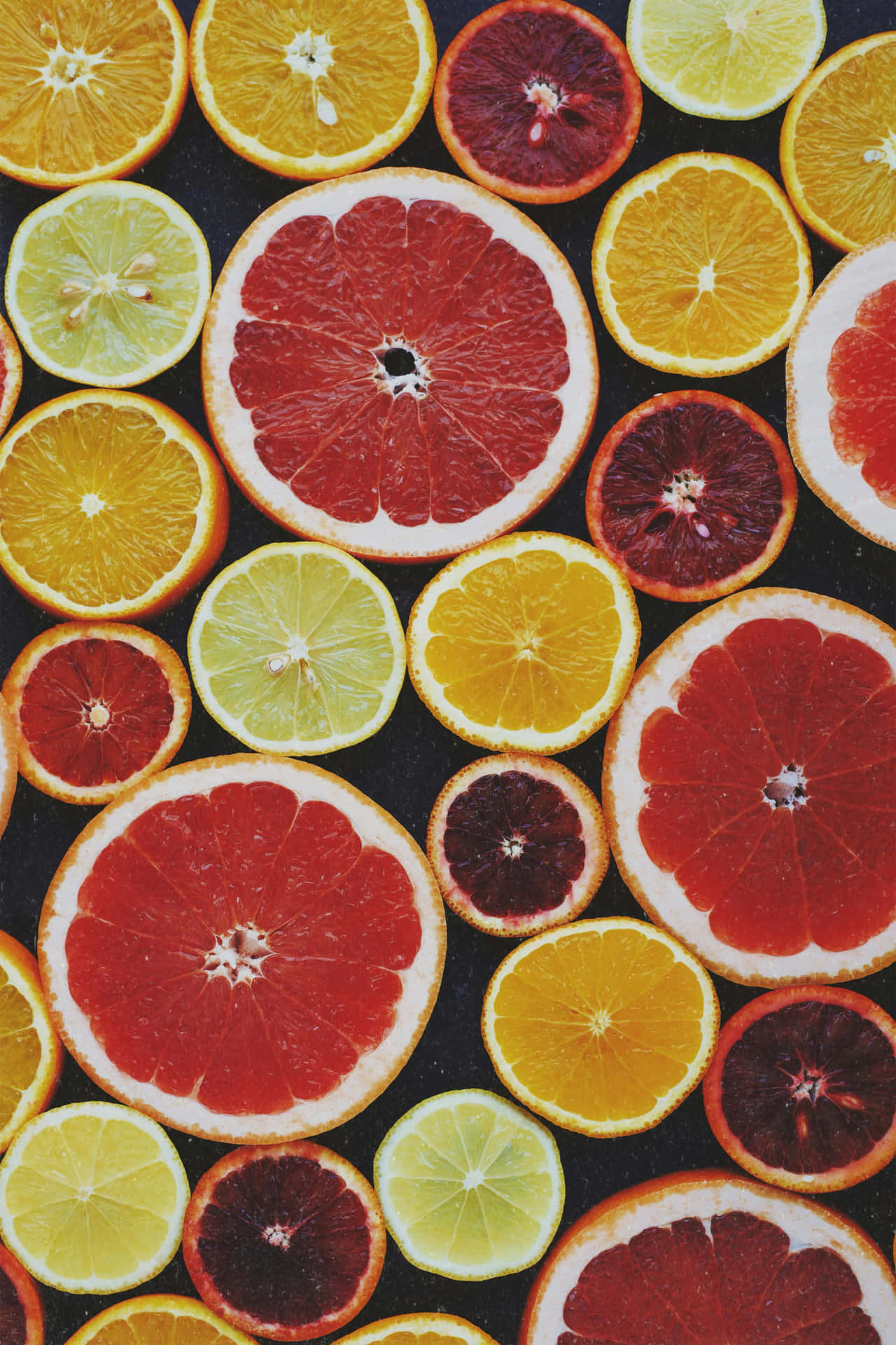 Colorful Citrus Slices Array Background