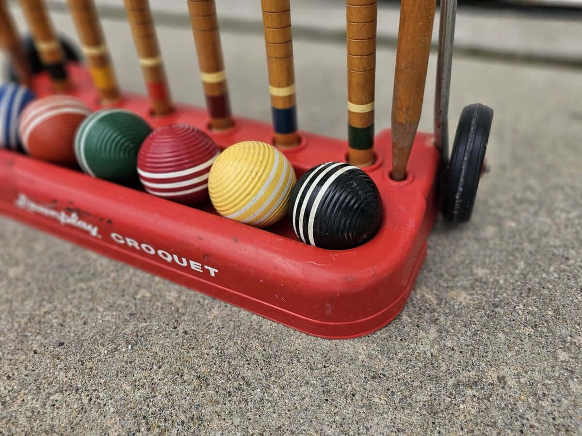 Colorful Croquet Ballsand Mallets Background