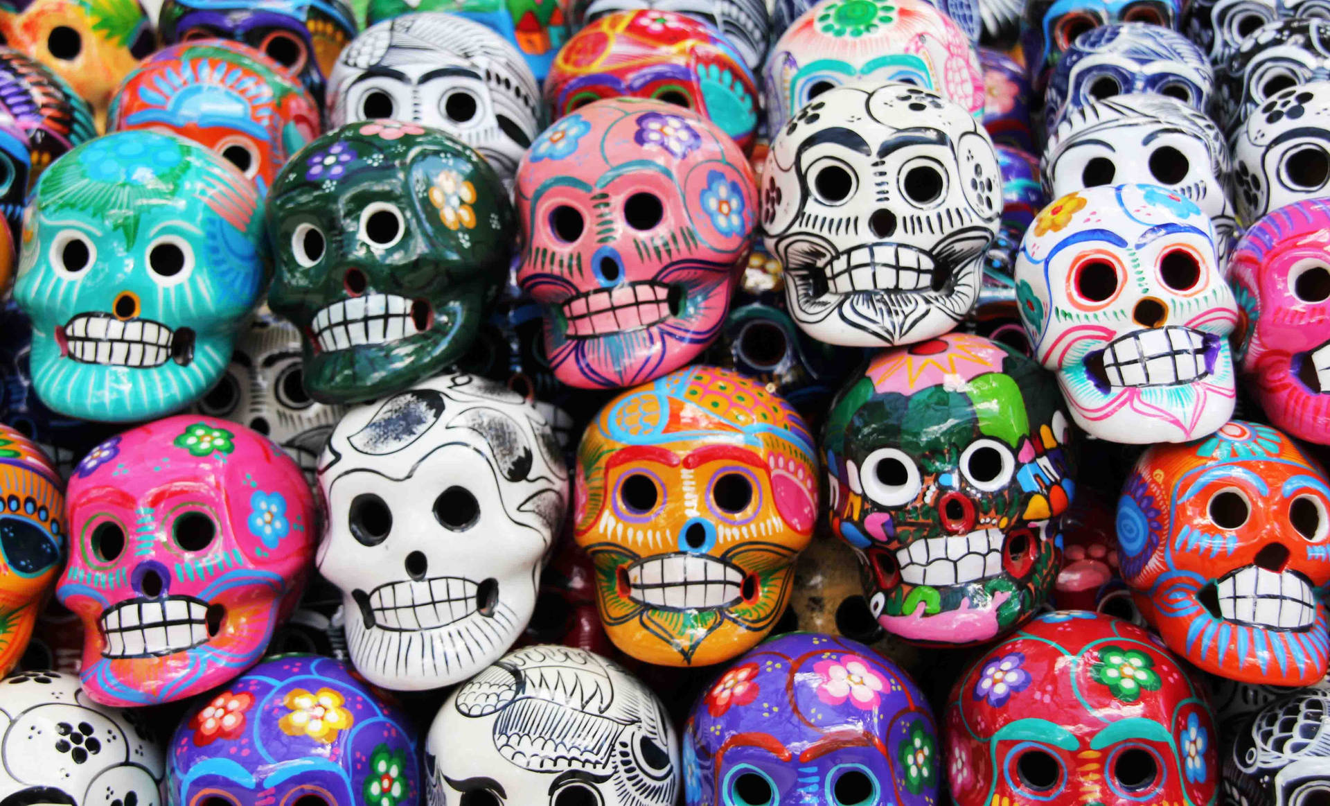 Colorful Day Of The Dead Skulls Background