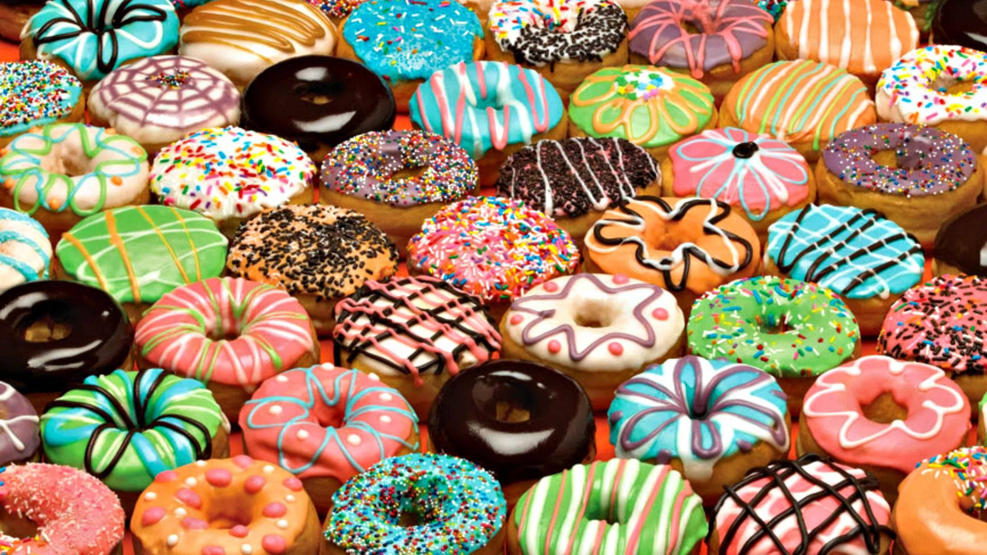 Colorful Donuts With Different Flavors Background