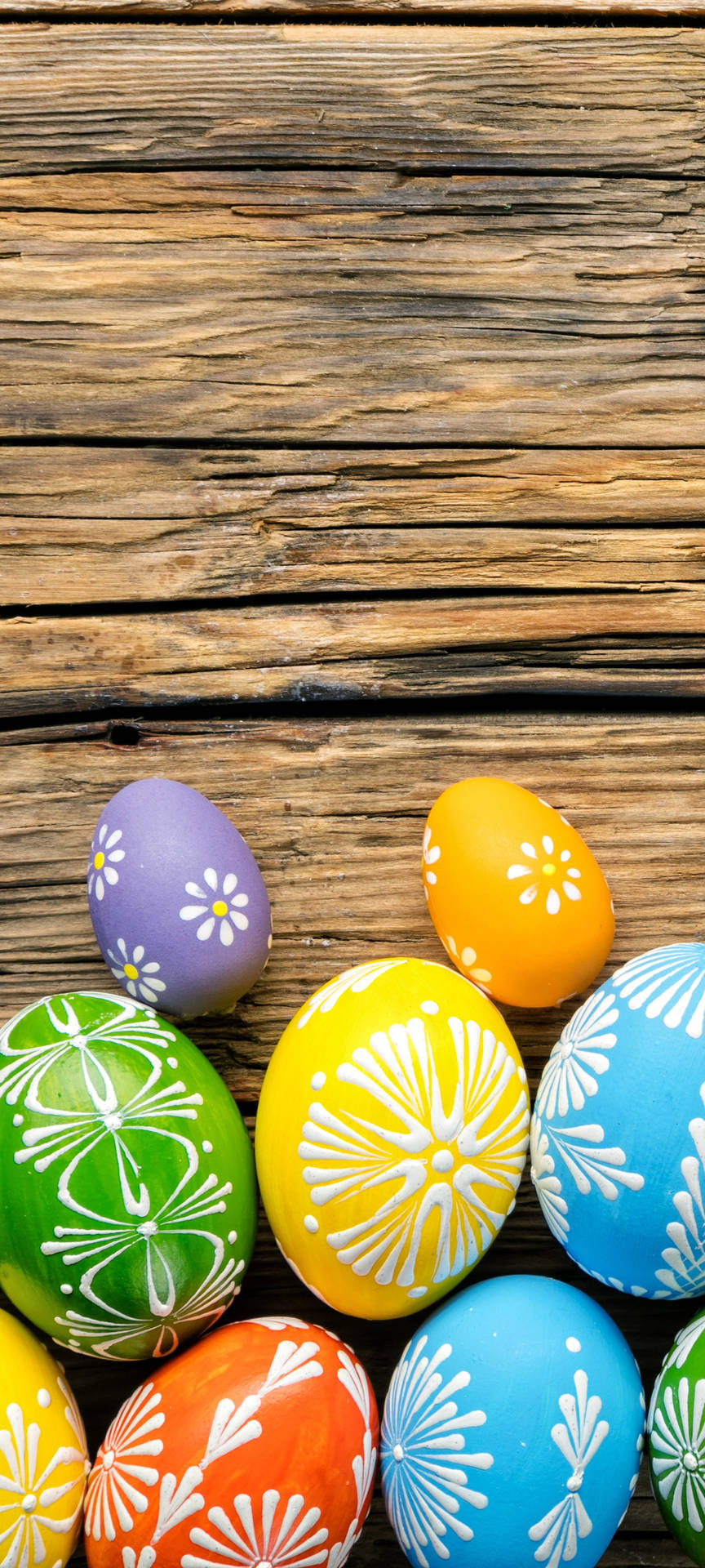 Colorful Easter Eggs On A Wooden Background Background