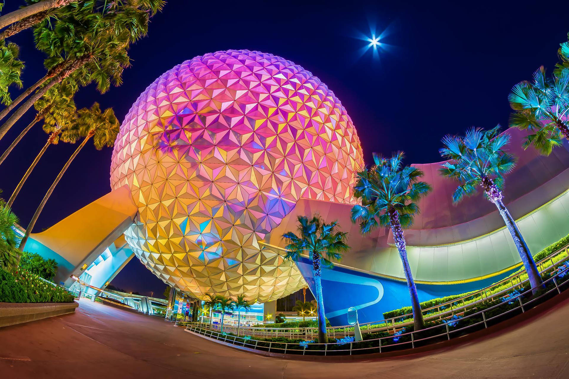 Colorful Epcot Globe With Trees Background