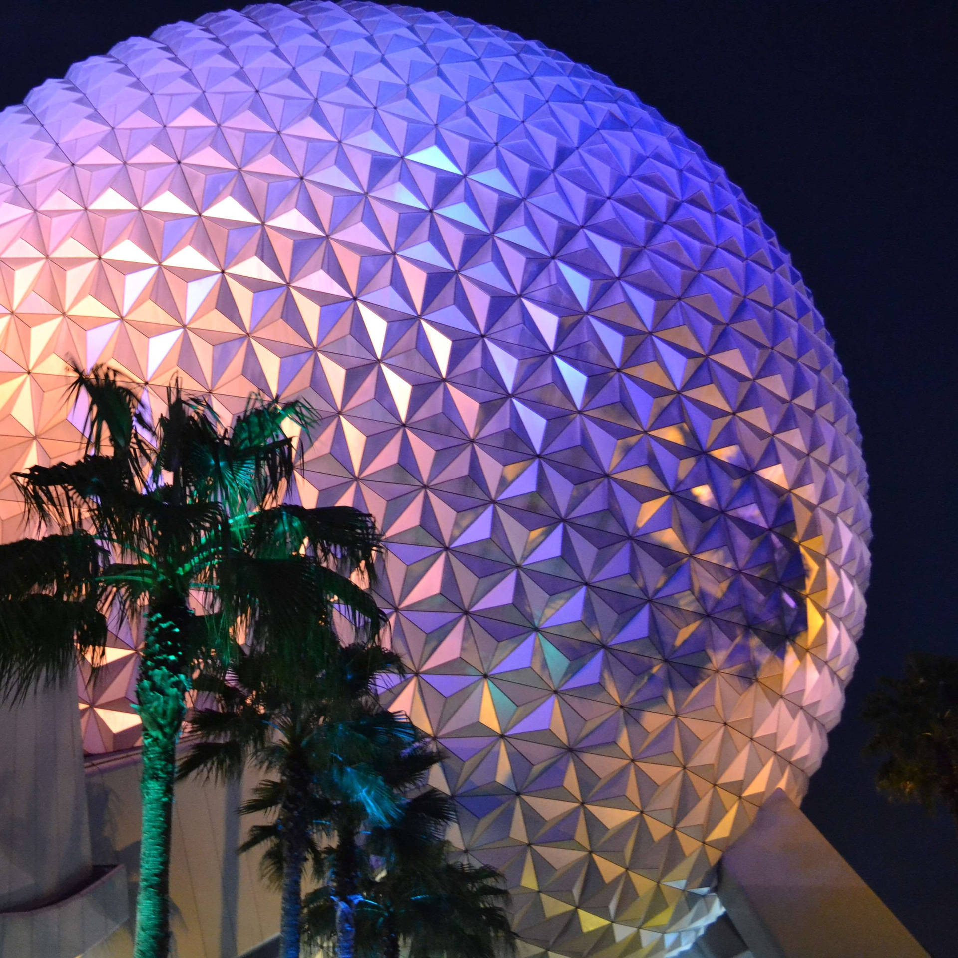 Colorful Epcot Globe With Trees Background