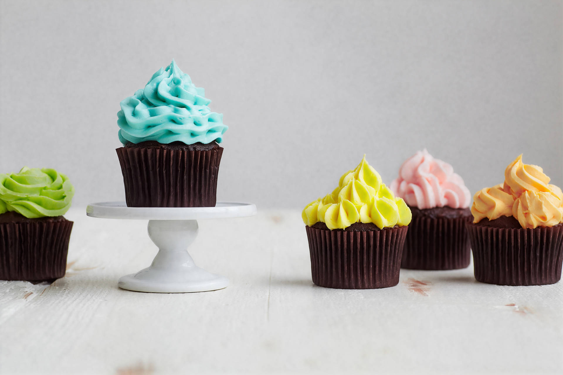 Colorful Frosting Cupcakes Background