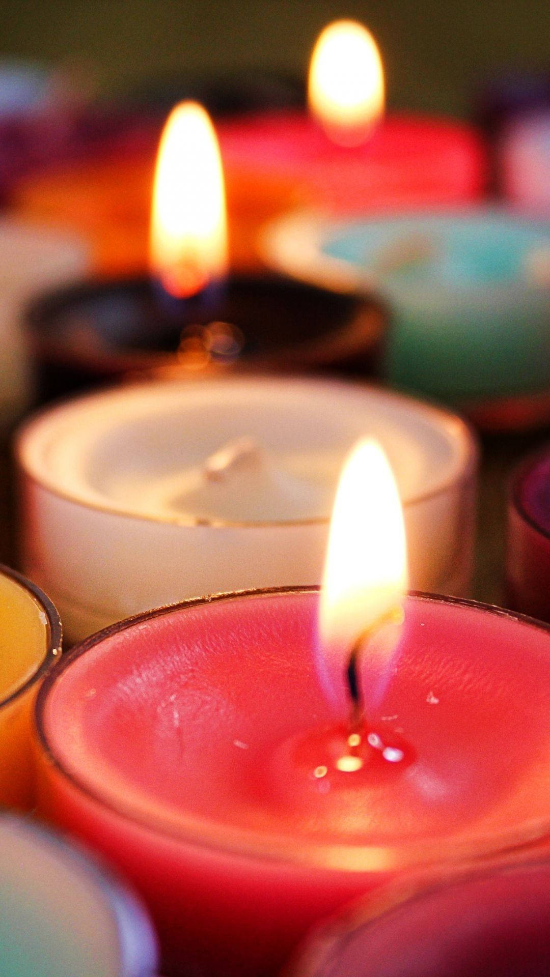 Colorful Glowing Candles Background
