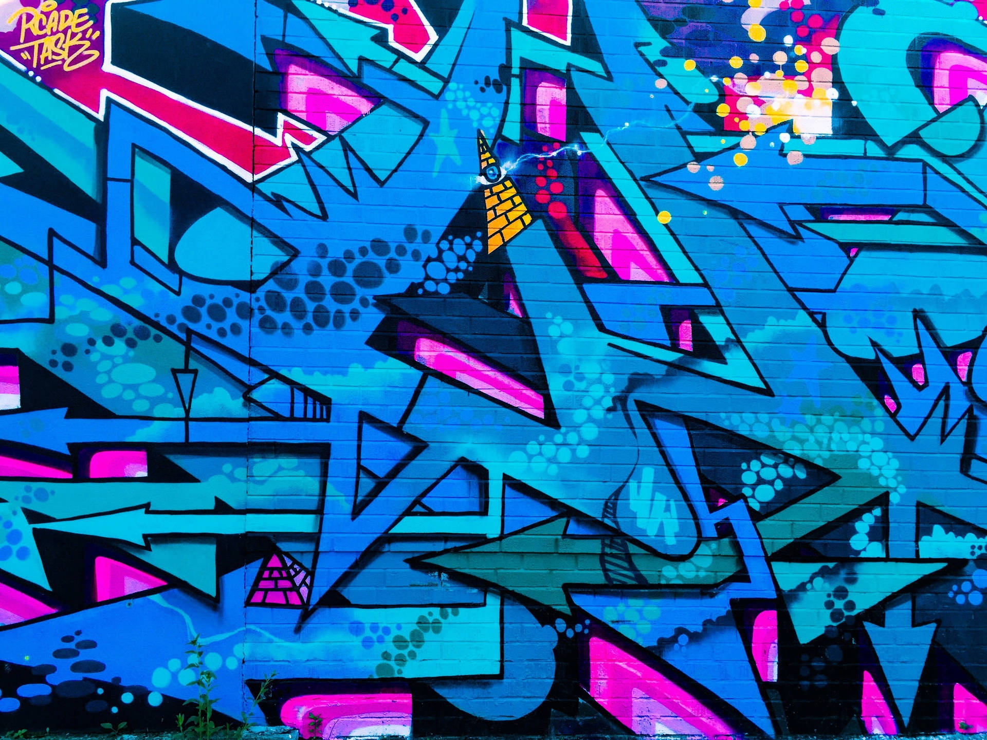 Colorful Graffiti Art Adorns City Street Background
