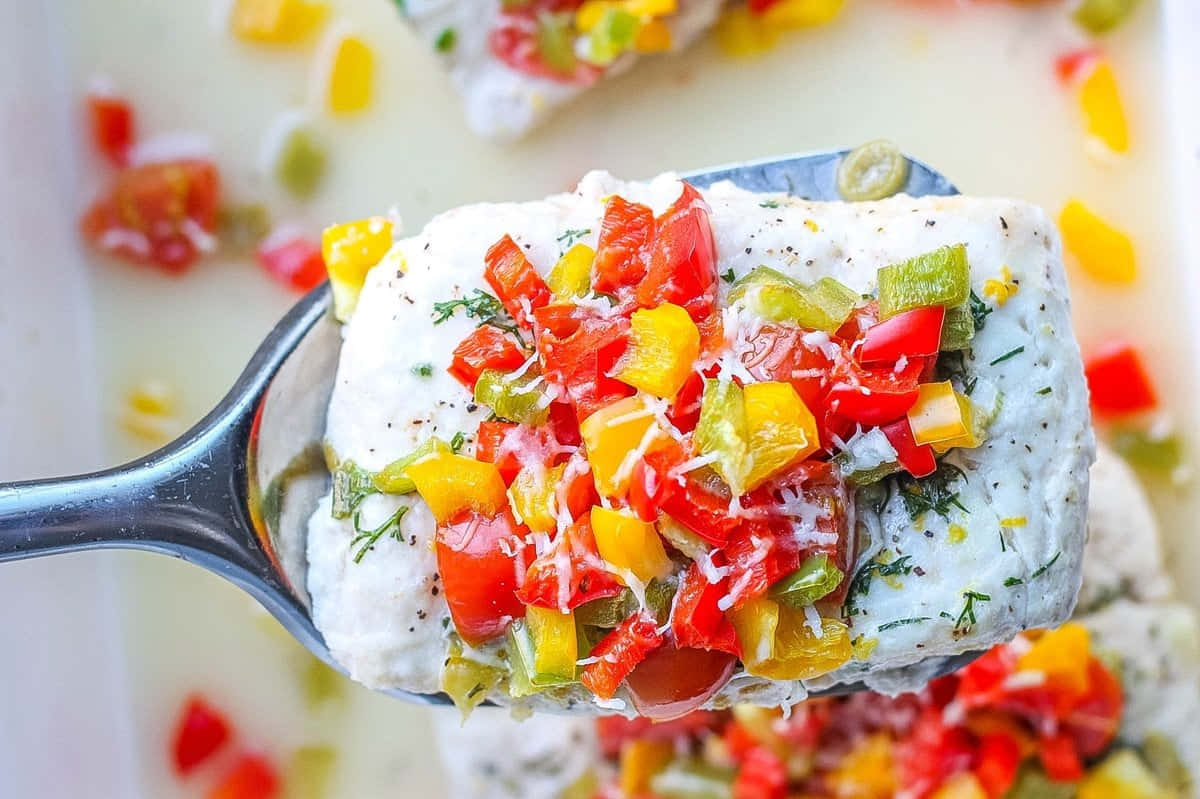 Colorful Halibut Steakwith Vegetable Topping Background