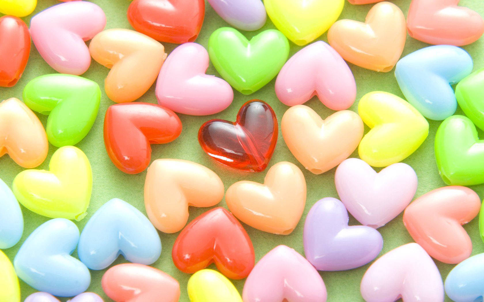 Colorful Hearts On Green Table Background