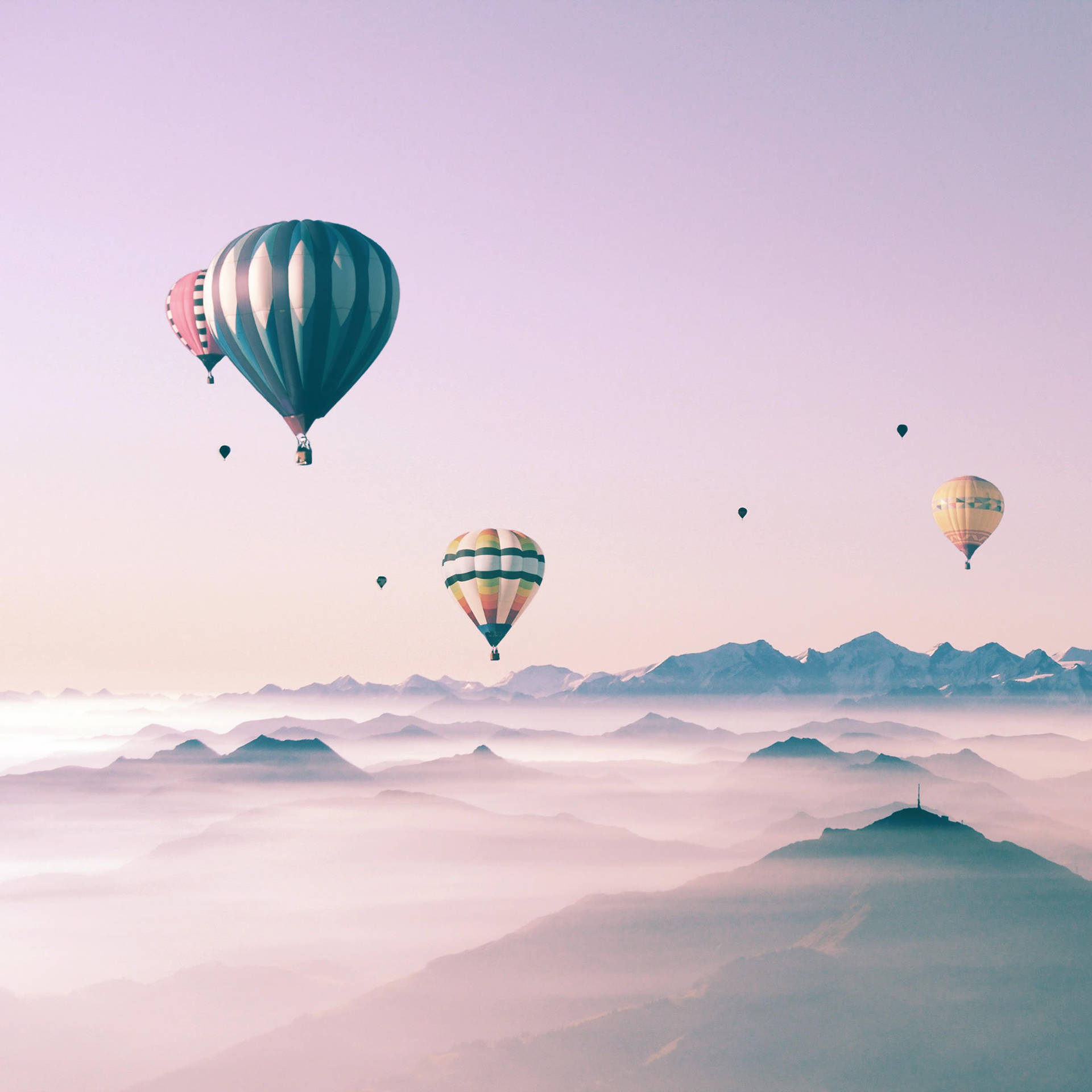 Colorful Hot Air Balloons Soaring In A Beautiful Sky Displayed On A Cute Ipad.
