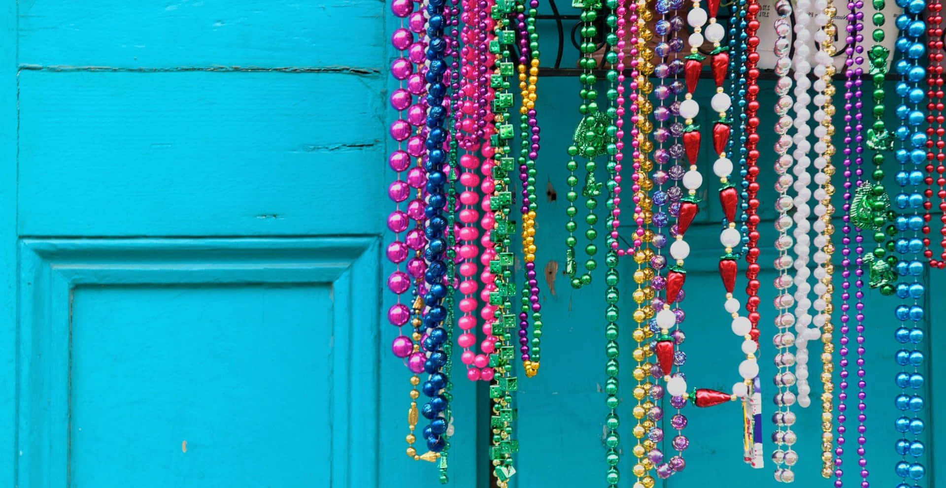 Colorful Mardi Gras Necklace Beads Background