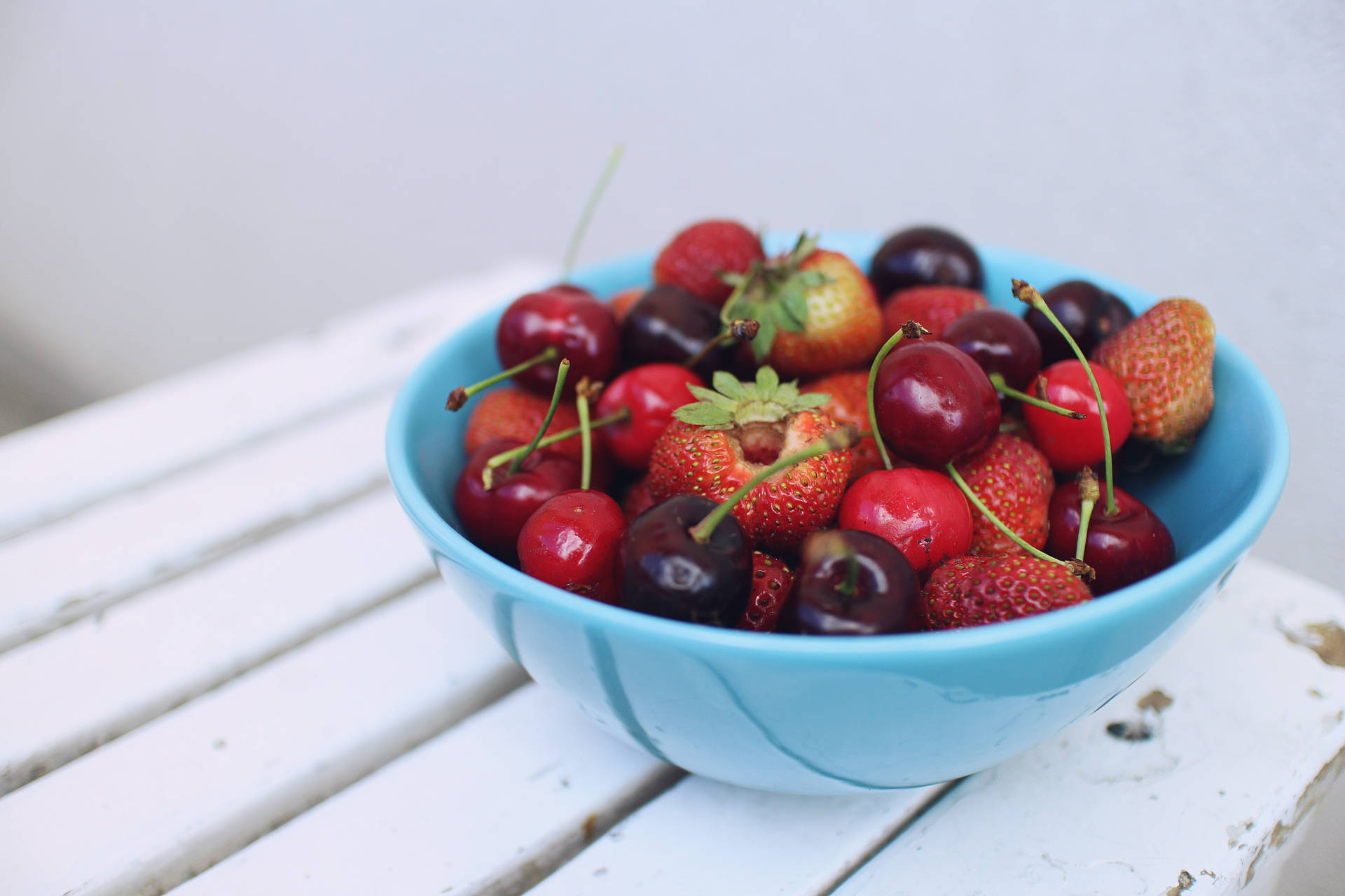 Colorful Mixed Berries In Bowl Background