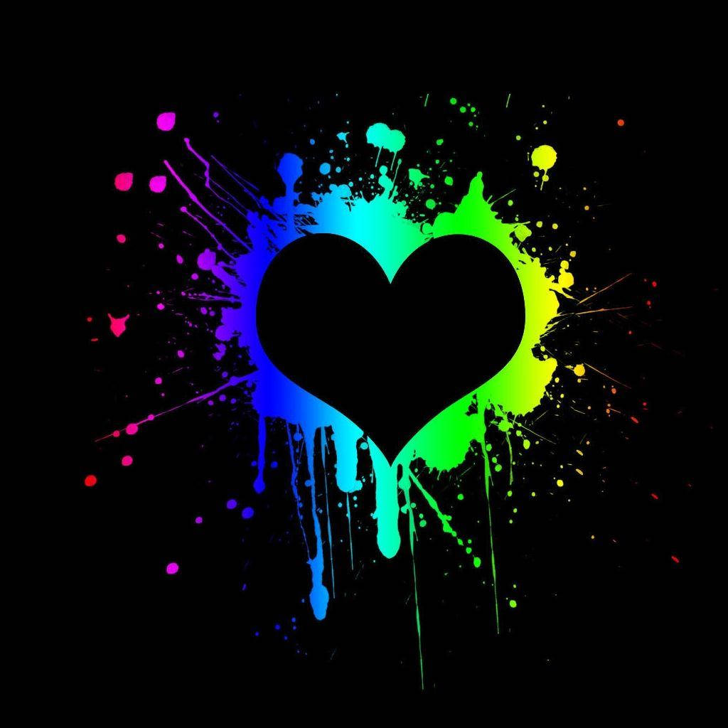 Colorful Paint Splatters Making Dark Heart Background