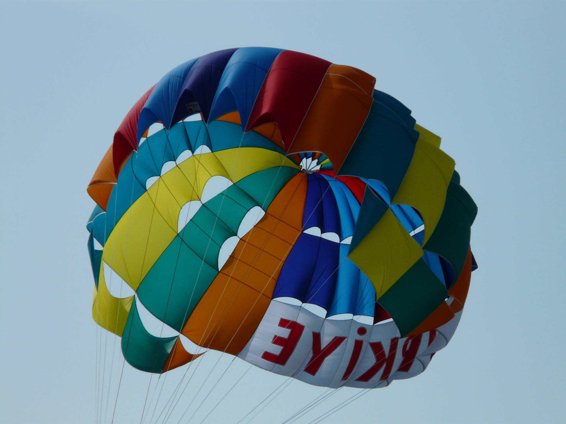 Colorful Parachutes For Parasailing Background