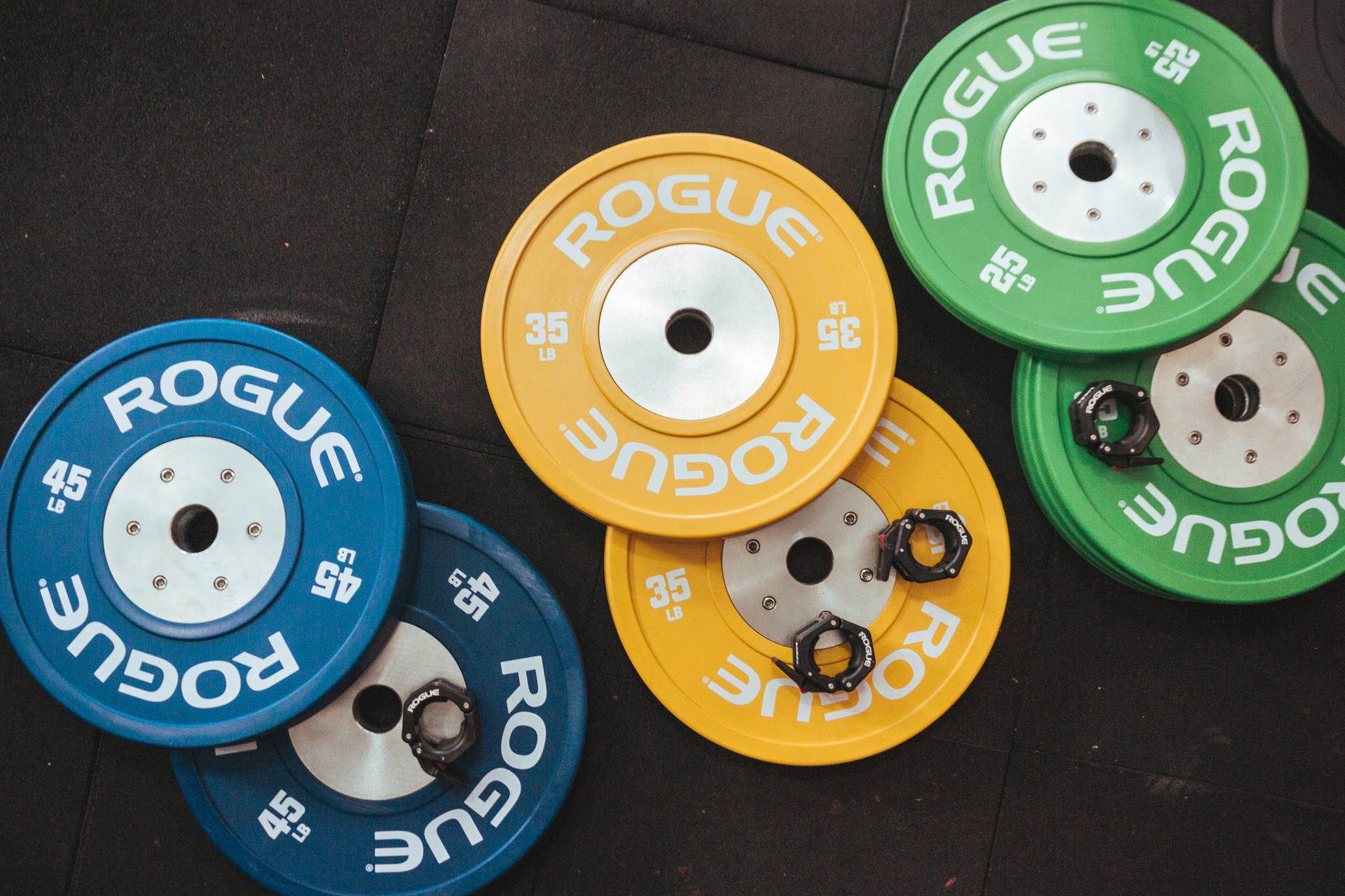 Colorful Rouge Plates For Weightlifting Background