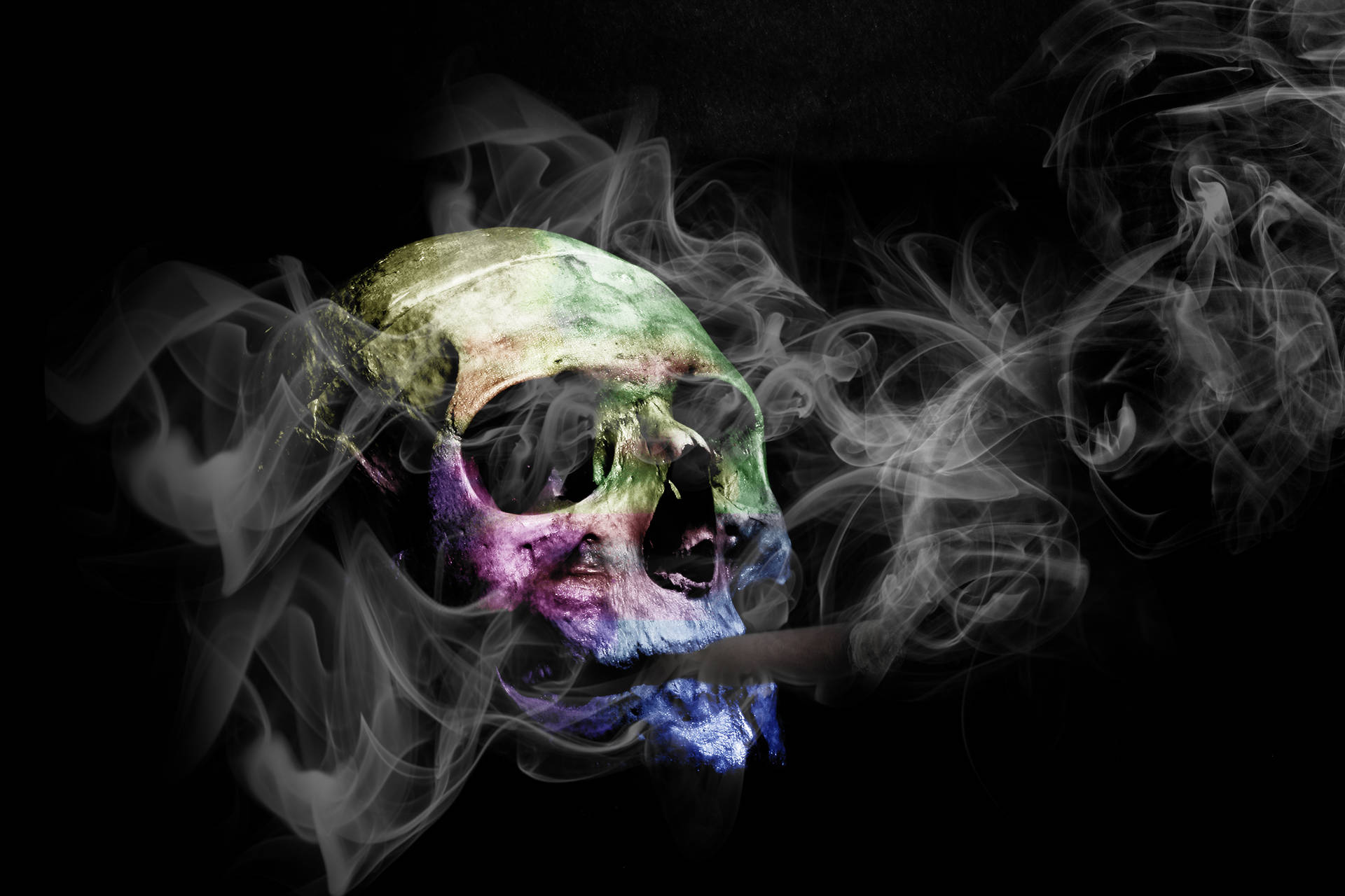 Colorful Skull Puffing Smoke With Tobacco Background