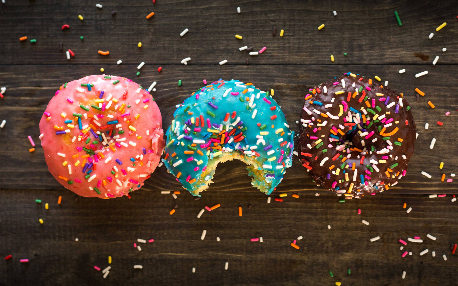 Colorful Sprinkled Donuts Background