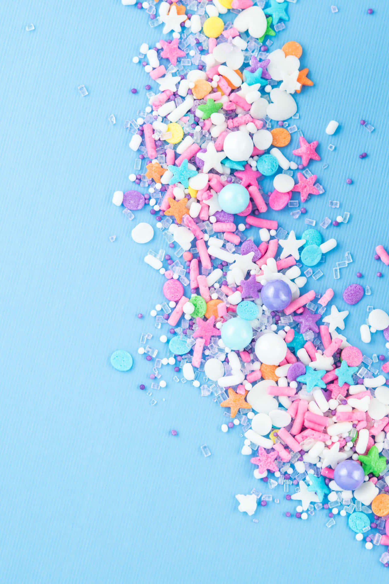 Colorful Sprinkleson Blue Background.jpg Background