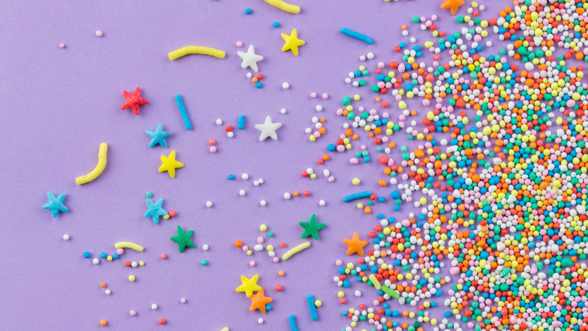 Colorful Sprinkleson Purple Background Background