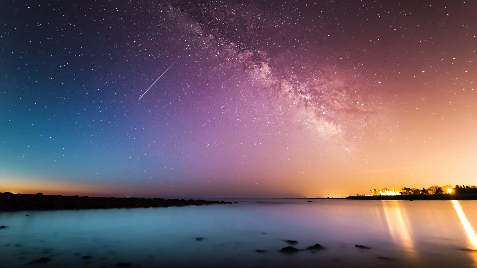 Colorful Star Sky Over The Sea Background