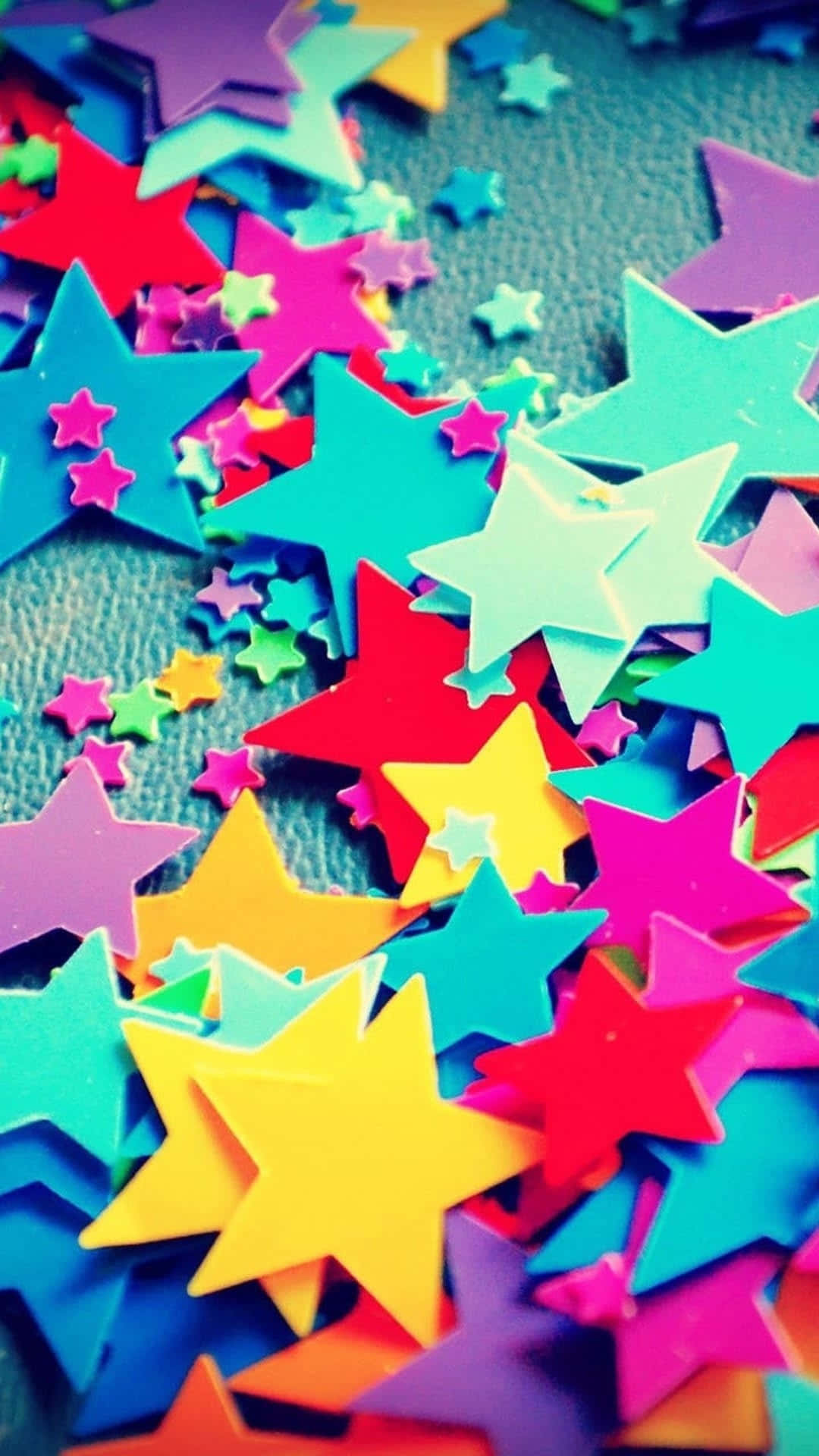 Colorful Stars Are Scattered On A Table Background