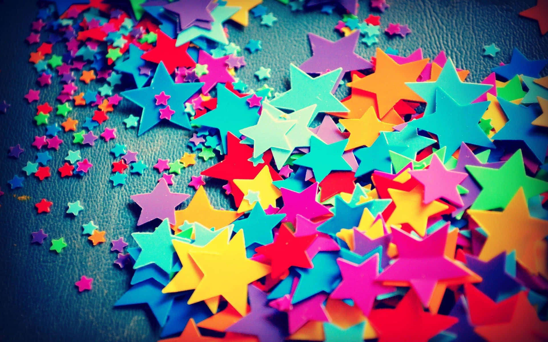 Colorful Stars On A Dark Surface Background