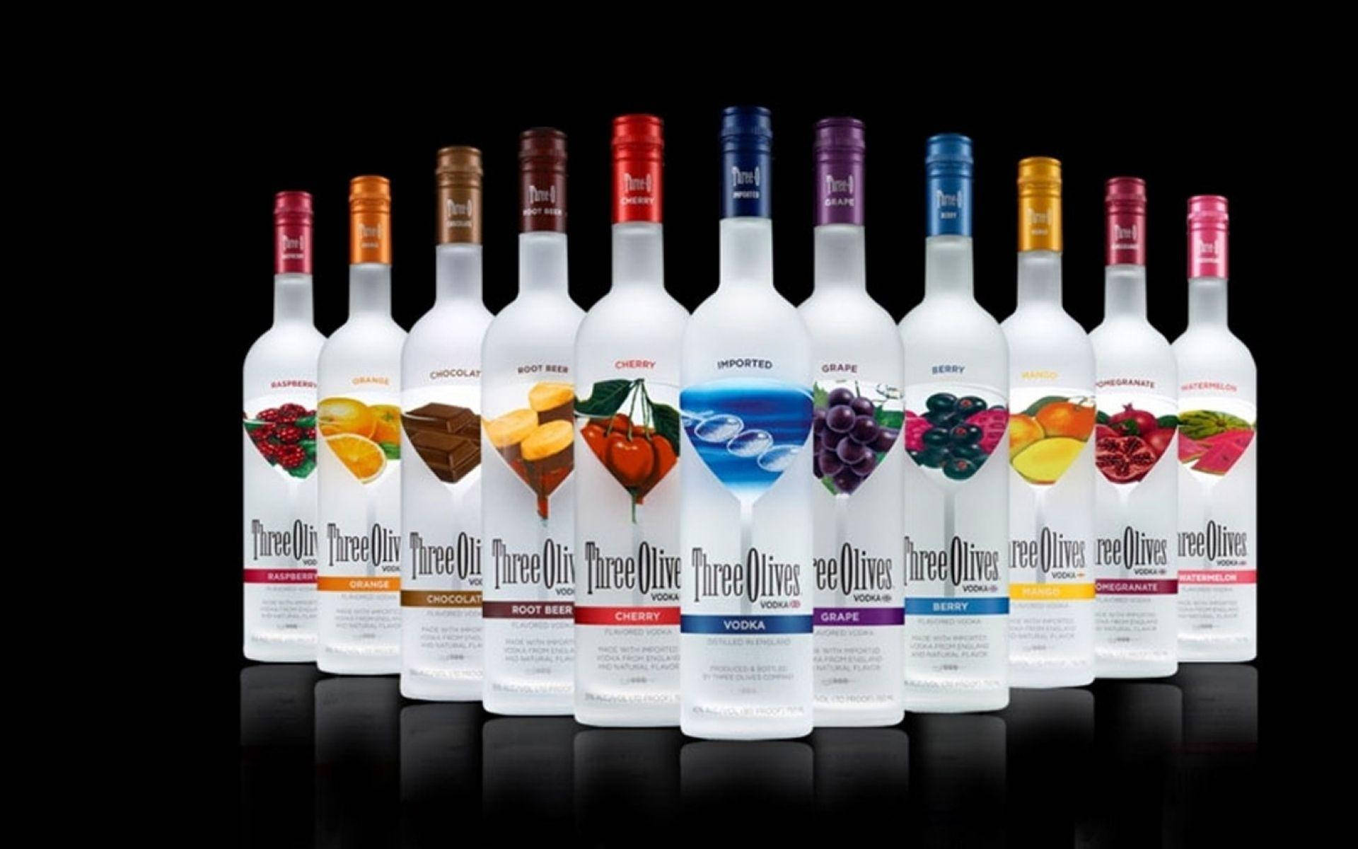 Colorful Three Olives Vodka Bottles Background