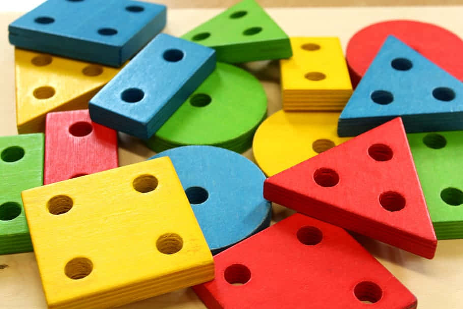 Colorful Wooden Shape Blocks Educational Toys Background