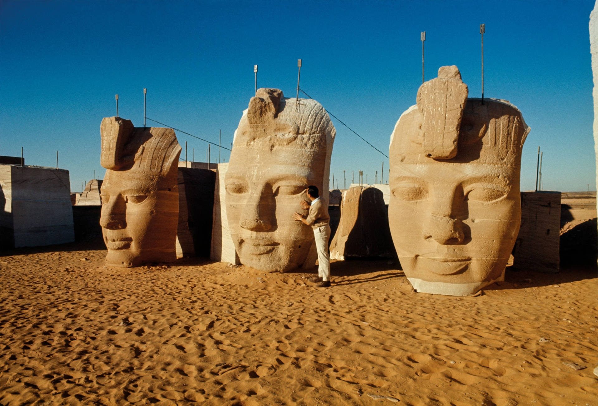 Colossal Statue's Faces At The Temple In Abu Simbel Background