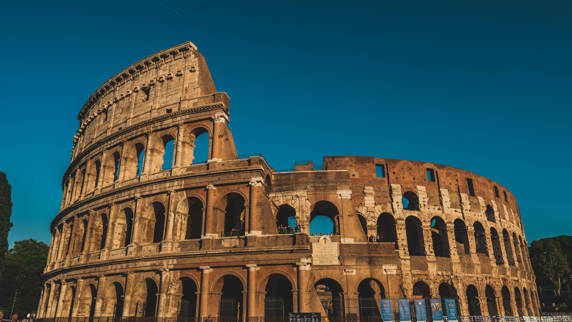 Colosseum In Rome Beneath Dark Blue Sky Background