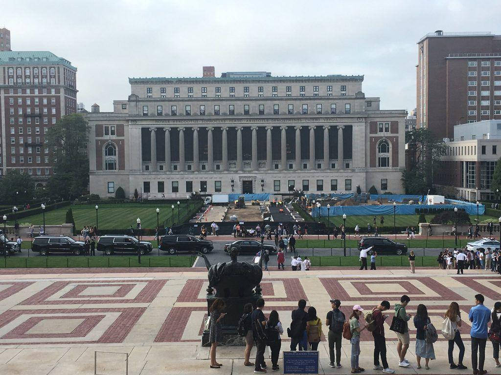 Columbia University Students Near The Sculpture Background