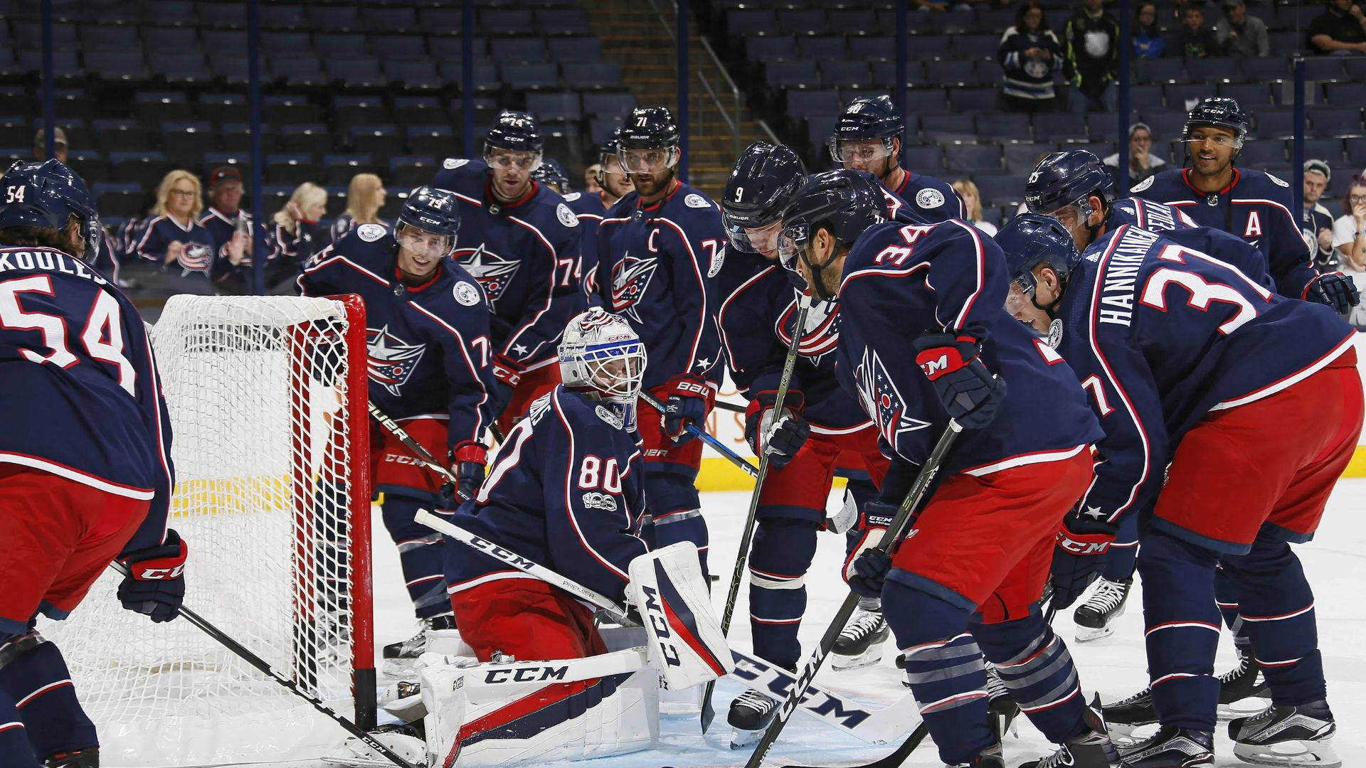 Columbus Blue Jackets Team Playing Hockey Background