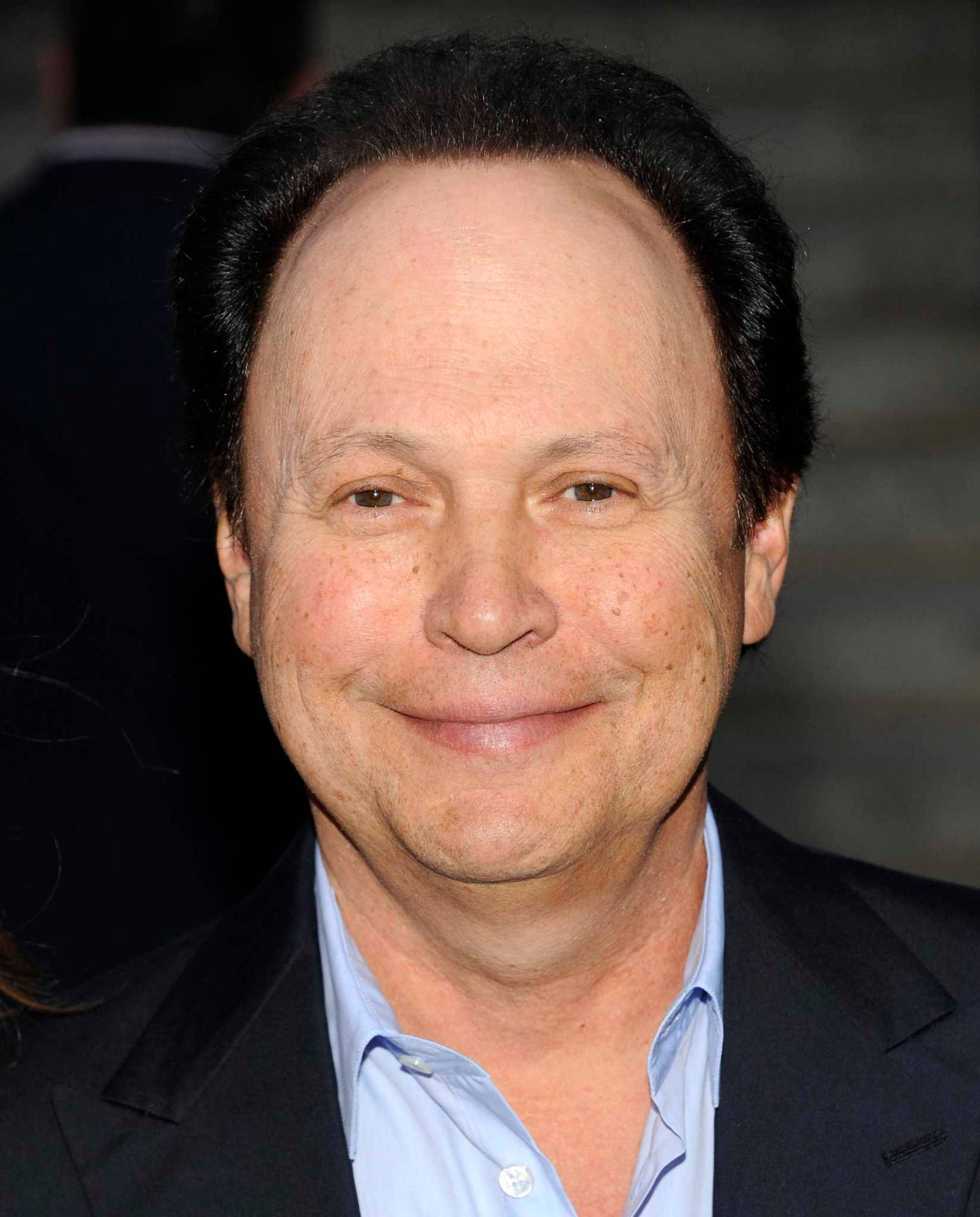 Comedian Actor Billy Crystal Smirk Background