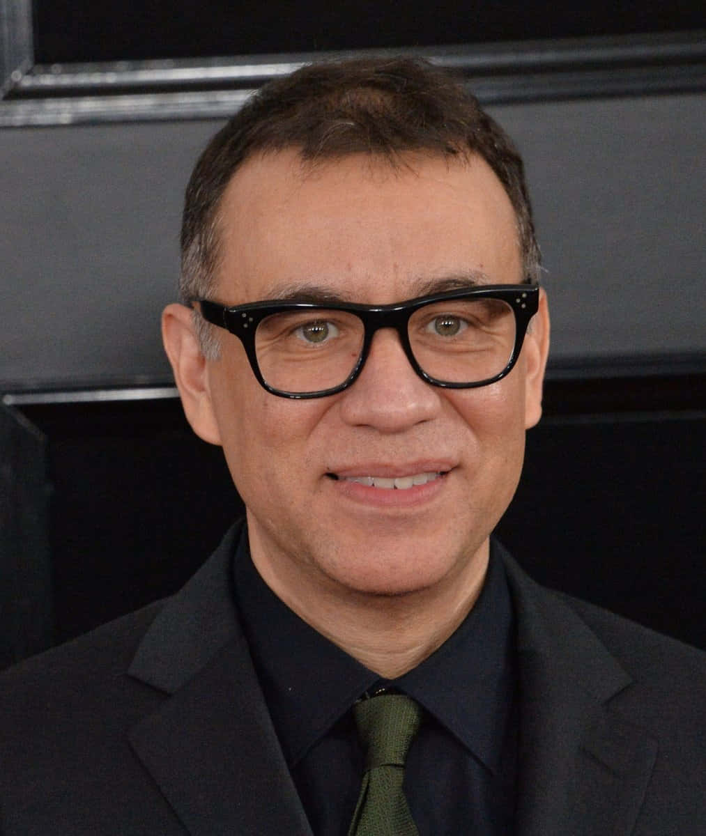 Comedian-actor Fred Armisen In A Yellow And Black Hoodie. Background