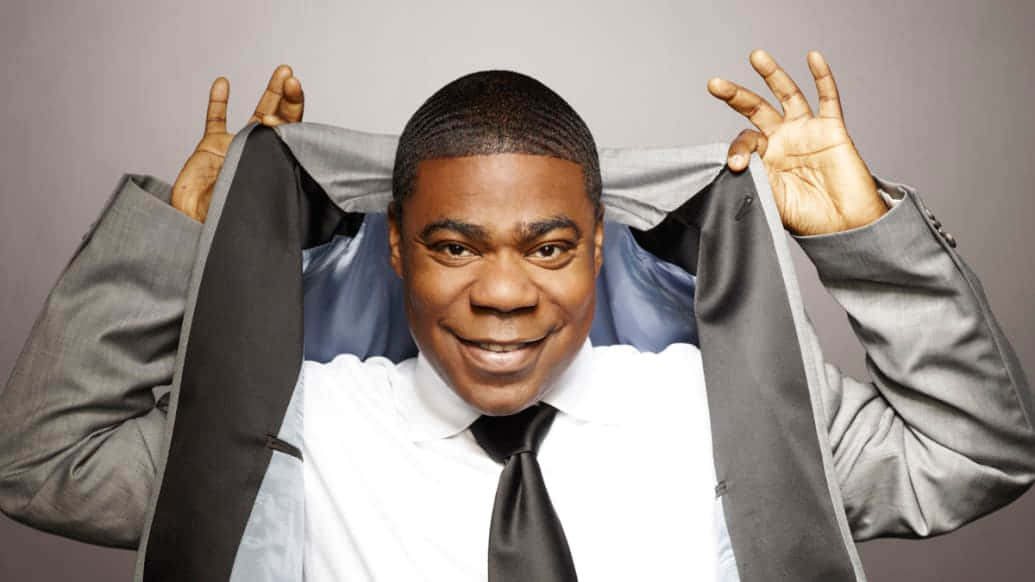 Comedian And Actor Tracy Morgan Posing For A Photoshoot Background