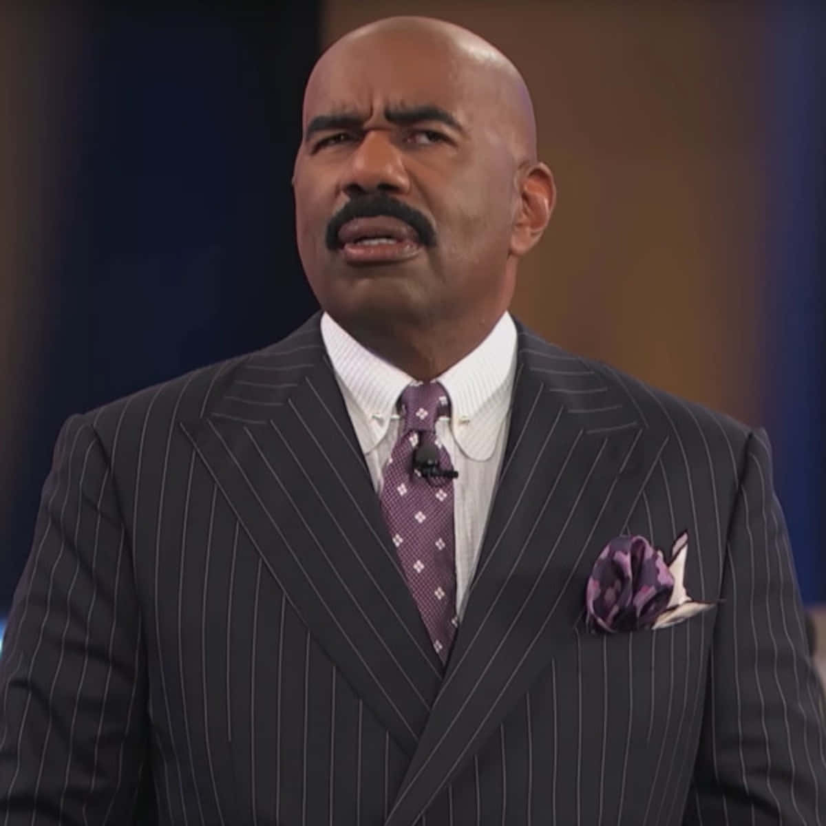 Comedian And Tv Host Steve Harvey With A Surprised Expression.