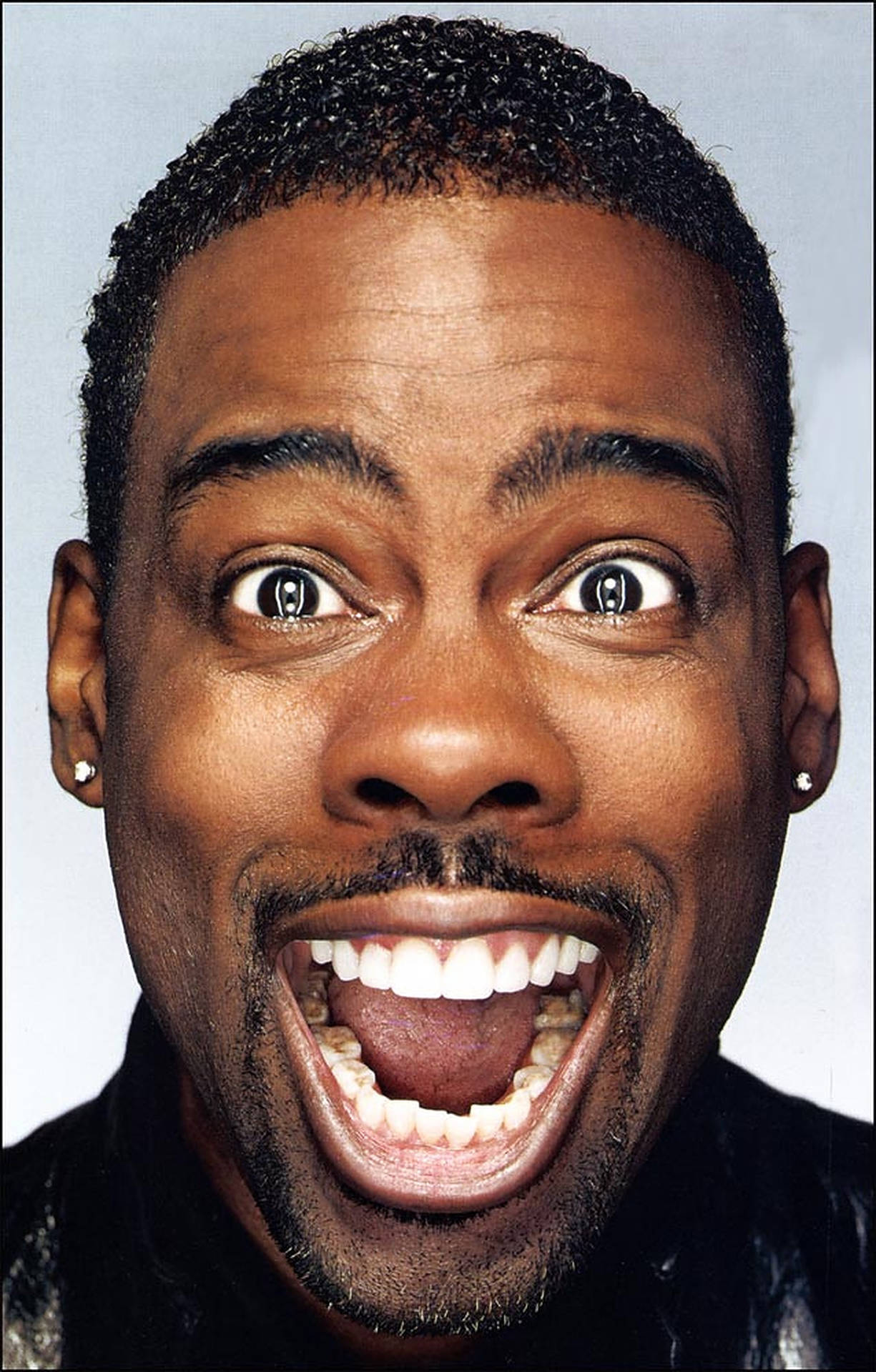 Comedian Chris Rock Making A Funny Face Background