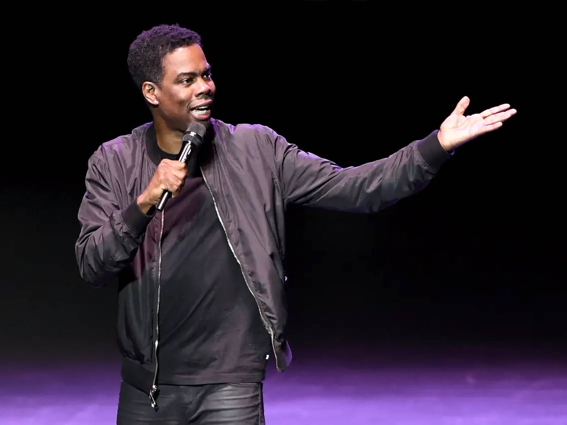 Comedian Chris Rock On Stage Background