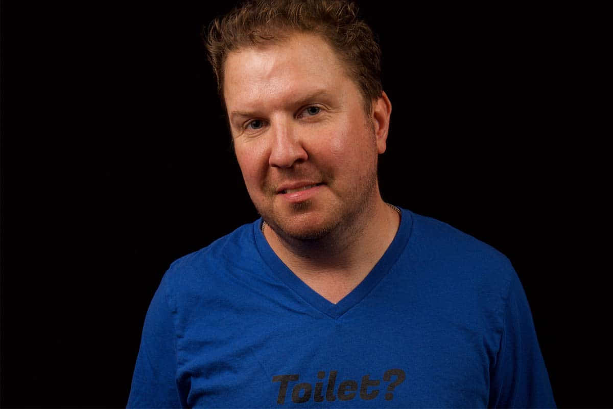 Comedian Nick Swardson Radiating Confidence Background