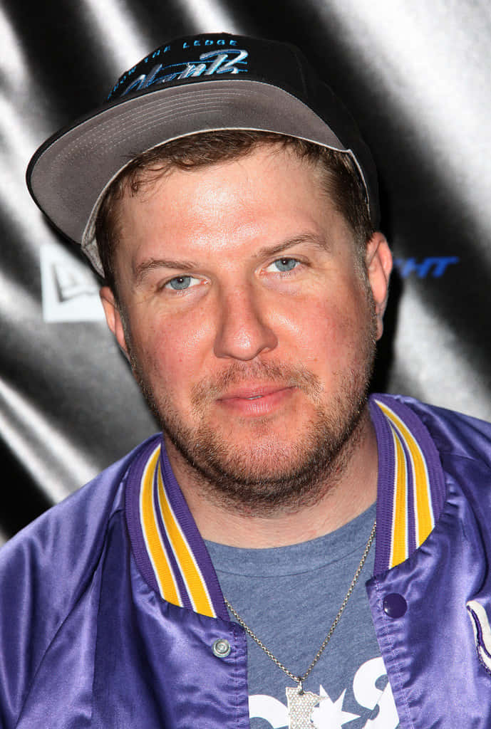 Comedian Nick Swardson Strikes A Goofy Pose For The Camera Background