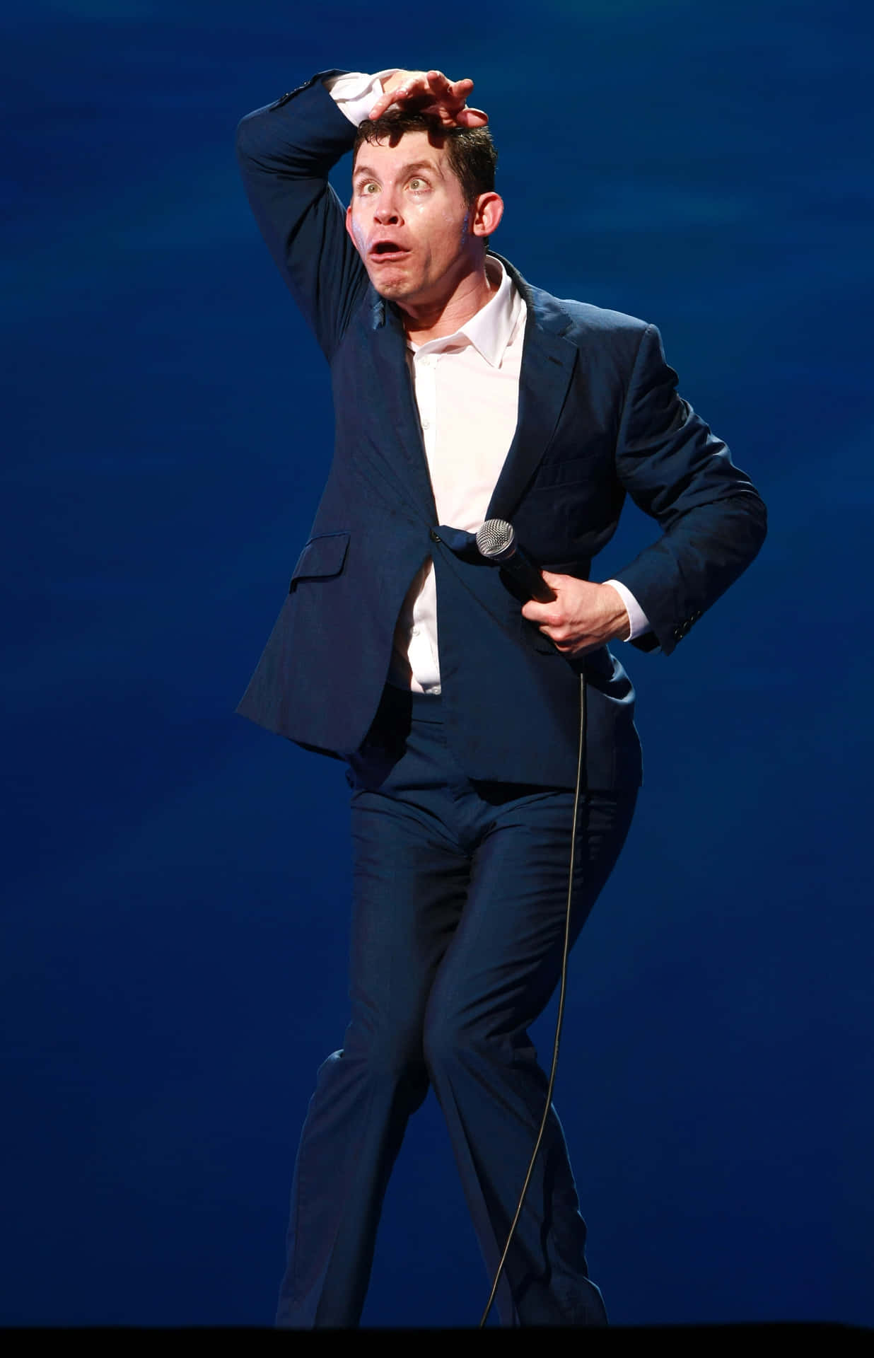 Comedian Performing On Stage Background