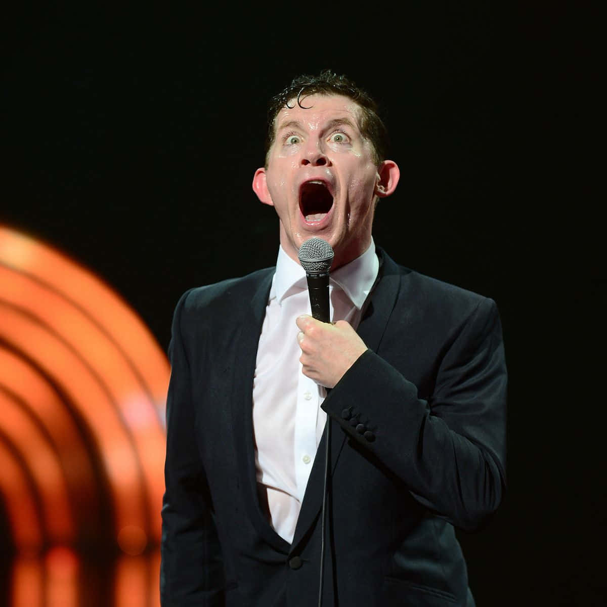 Comedian Performingon Stage Background