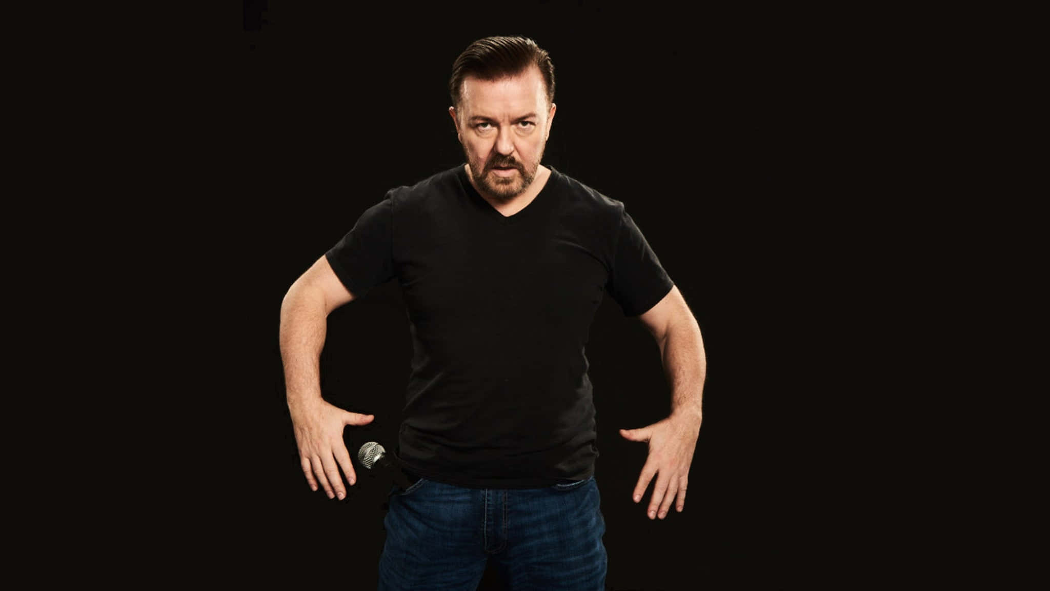 Comedian Ricky Gervais Laughing At A Comedy Event