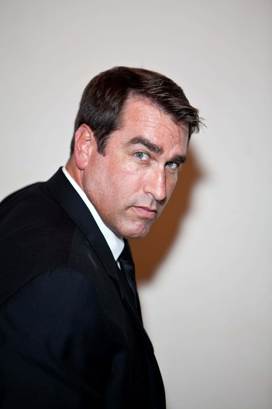 Comedian Rob Riggle In Casual Attire Background