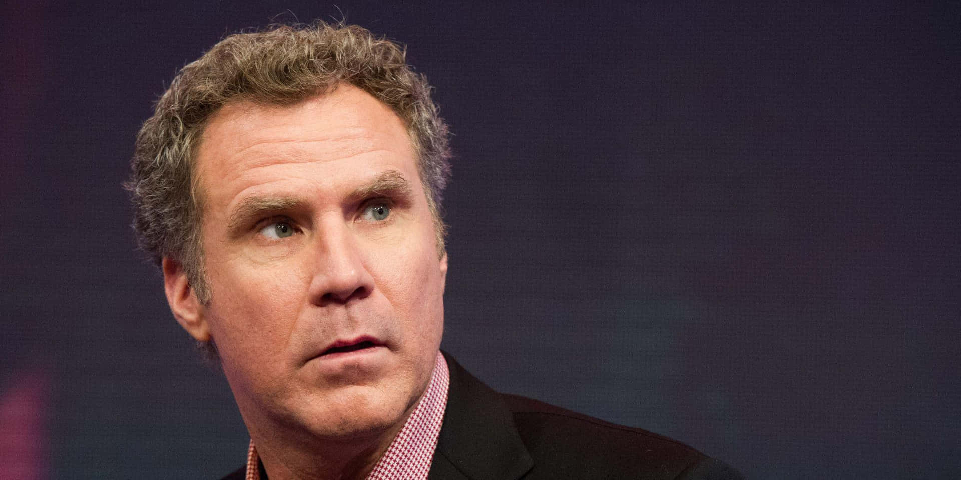 Comedian Will Ferrell Striking A Humorous Pose Background